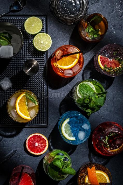 Cocktails set on black bar counter, top view. Mixology concept. Assortment of colorful strong and low alcohol drinks for cocktail royalty free stock Black Bar Counter, White Claw Vodka, Drinks Photoshoot, Bar Counter Top, Low Alcohol Drinks, Orange Cocktails, Cherry Liqueur, Green Bar, November Birthday