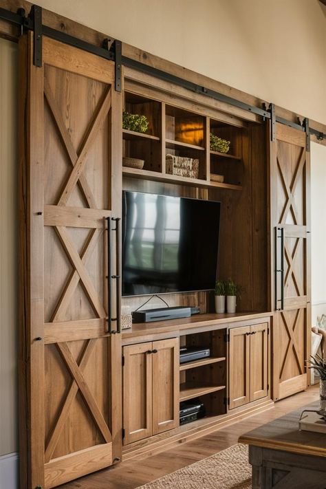 Transform your living space with a rustic-chic barn door entertainment center! Explore how these sliding beauties conceal your tech while adding countryside charm. From rich pine to weathered gray, find the perfect wood tone for your farmhouse vibe. We'll show you how to blend practicality with style, creating a cozy hub for family movie nights and stylish storage. Get ready to wow guests with this statement piece! #FarmhouseMedia #RusticStorage #CozyLivingRoom Rustic Farmhouse Entertainment Center, Rustic Entertainment Center Ideas, Country Entertainment Center, Warm Farmhouse Living Room, Southwestern Dinnerware, Built In Cabinets Living Room, Warm Farmhouse, Rustic Entertainment Center, Barn Door Cabinet