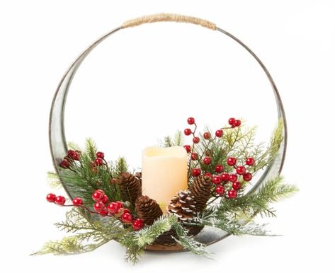 Bring a stunning seasonal look to your home during the holidays using this centerpiece. A galvanized ring frame is accented with an artificial arrangement of pine needles, pinecones and berries as an LED candle illuminates warmly in the center. It's a beautiful addition to a mantel, table or shelf display. Christmas Party Centerpieces, Christmas Wedding Table, Xmas Centerpieces, Winter Floral Arrangements, Christmas Party Table, Ring Frame, Christmas Wedding Decorations, Christmas Vases, Christmas Scented Candles