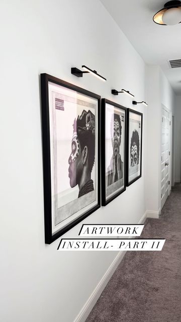 Black Art In Living Room, Art Gallery Wall With Lights, Art Wall With Lights, Wall Lights Over Pictures, Wall Lights For Pictures, Artwork With Light Above, Amazon Picture Light, Lights Over Artwork, Large Pictures In Hallway