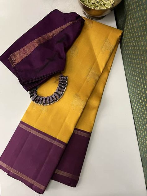 Pure kanchipuram silk saree woven in the korvai style , this saree is a signature Aavaranaa creation. The body has the kamdhenu motifs woven in pure zari, the border is kept simple but the pallu is richly woven in a traditional pattern with mythological figures and other smaller patterns like rudrakshams. This is a bright mustard yellow with deep mauve border. The blouse piece is plain border colour Saree Combination, Saree Yellow, Saree Styling, Katan Saree, Saree Kanchipuram, Kanchi Sarees, Kanjeevaram Sarees, Cotton Saree Blouse, Aari Blouse