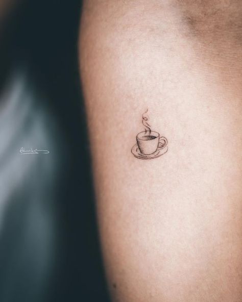 Small Tattoos Coffee Cup, Minimalist Coffee Mug Tattoo, Small Cup Of Coffee Tattoo, Dainty Coffee Cup Tattoo, Aesthetic Coffee Tattoo, Coffee Croissant Tattoo, Tiny Coffee Cup Tattoo, Cup Of Coffee Tattoo Minimalist, Fine Line Coffee Cup Tattoo