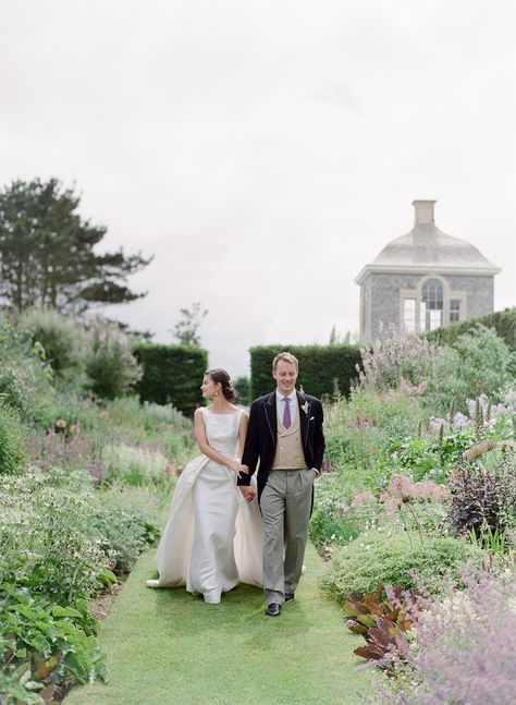 peony matthew england wedding couple walking through garden Peony Lim, English Country Weddings, Wedding Blessing, English Garden Wedding, British Wedding, Country Garden Weddings, Peonies And Hydrangeas, English Wedding, Peony Wedding