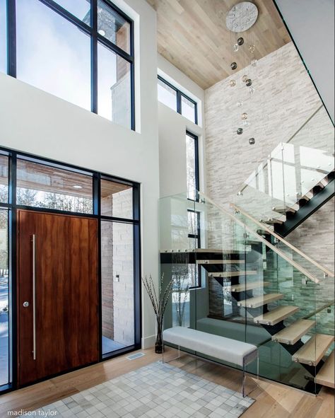 Making a statement with this front entrance • Our custom integrated residence welcomes you inside with this stunning ambience. A mahogany… Glass Stairs Design, Modern Foyer, Staircase Design Modern, 2 Storey House Design, Glass Stairs, Modern Entrance, Stairway Design, Stairs Design Modern, Modern Entryway