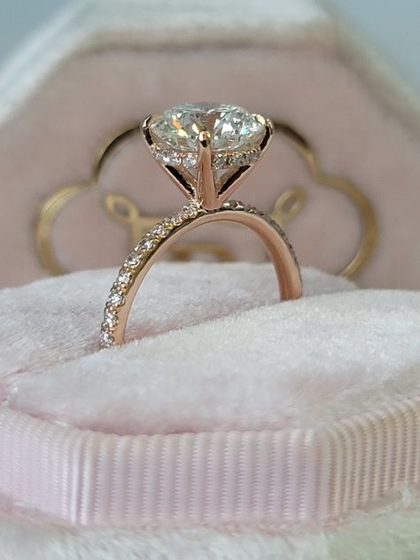 A classic & brilliant choice of a ring! This gorgeous and elegant 2.54 carats engagement ring has a 2 carat lab grown round brilliant cut center diamond and is IGI certified at "F" in color and "VS1" in clarity, (Excellent Cut, Polish and Symmetry) and is set in a classy hidden halo setting all in a 14k rose gold setting with micropaved side stones as well. The ring can also be made in white/yellow gold or platinum and can even be redesigned to your choice. Comes with EGI certification and our l Brilliant Diamond Engagement Ring, Rose Gold Engagement Ring Round Diamond, Rose Gold Round Halo Engagement Ring, Engagement Rings With Halo Underneath, 2 Carat Round Cut Diamond Ring, Round Rings Engagement With Band, 2 Carrot Round Diamond Ring, Round Diamond Ring Gold Band, Rose Gold Hidden Halo Engagement Ring