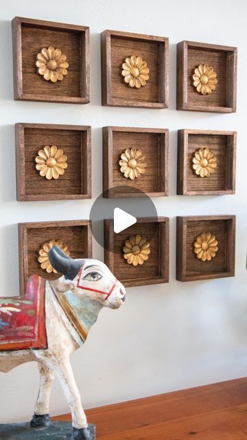 Mitesh | Home & Design on Instagram: "This was such an easy project with a big impact. I found these small wood plaques at the $1 bin @michaelsstores and knew they would work great for what I had in mind. I stained them in a walnut color along with wood rosettes from @amazon. I finished off the rosettes with RubnBuff in antique gold to give it the look of antique brass. Then they were ready for the wall. I grouped together 9 but you could do any number of arrangements. I wanted it to kind of loo Living Room Wall Decor Ideas Indian, Mdf Wall Design, Wall Molding Living Room, Indian Living Room Decor, Wood Rosettes, Indian Wall Decor, Vintage Brass Decor, Indian Living Room, Indian Wall Art