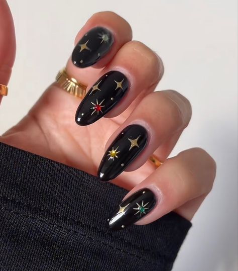 Black And Gold Witchy Nails, Black Gold Star Nails, Engagement Nails Colorful, Classy Witchy Nails, December Nails Short Almond, Moody Acrylic Nails, Fall Celestial Nails, Simple Nail Art Halloween, Witchy Inspired Nails