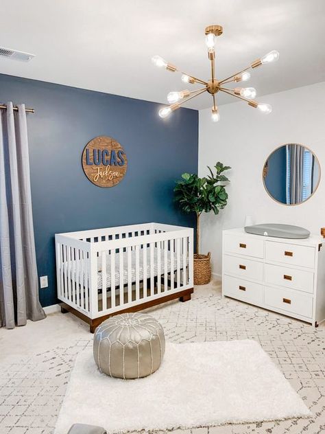 Picture of a stylish modern nursery with a blue wall Navy Wallpaper Accent Wall, Wallpaper Accent Wall Nursery, Accent Wall Nursery, Blue Accent Wall, Navy Nursery Boy, Navy Blue Nursery, Name Sign For Nursery, Blue Nursery Boy, Navy Nursery