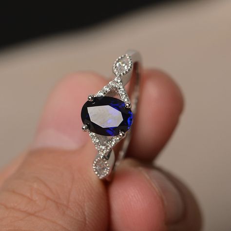 This is a gorgeous handmade creation. Its beauty is its simplicity & Elegance. The 6*8 mm oval shape faceted lab Sapphire is crafted in solid sterling silver and with rhodium plated. CZ as accents. All item is sent in a beautiful gift box If you have any idea of design your ring,pls contact me directly. You can realize more lovely stuff clicking the link https://www.etsy.com/shop/knightjewelry?refshopsection_shophome_leftnav Please leave the correct address and you phone number for deliverin Saphire Engament Ring Set Silver, Rings Oval, Rings Sapphire, Cut Rings, Oval Sapphire Ring, Blink Blink, Rings Promise, Gothic Ring, September Birthstone Rings