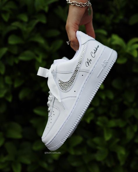 Stepping into forever with a touch of sparkle. ✨ Our custom Air Force 1 low bridal sneakers are the perfect blend of style and comfort for your special day. 👟💐. . . . . . . #BridalSneakers #CustomKicks #bridetobe #bride #weddingideas #weddingstyle #bridalshoes #bridestyle #bridesmaids #bridesmaid #nike #rhinestones #satin #airforce1 #customsneakers #sneakernews Sneakers For Bride, Wedding Sneakers For Bride, Shoes Air Force, Bride Personalized, Air Force 1 White, Bridal Sneakers, Wedding Sneakers, Shoes Air, Custom Bridal