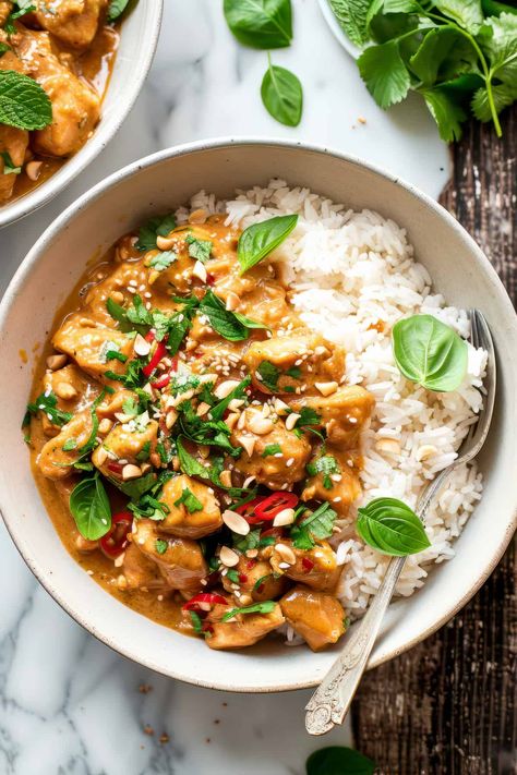 A quick and easy 30-minute chicken recipe, this peanut butter chicken with coconut sauce is a great budget-friendly dinner recipe. Creamy peanut coconut sauce with a little bit of spice, all tossed with bell peppers and crispy tender chicken. Serve over rice or noodles. Similar to a peanut satay sauce this recipe freezes well making it perfect for meal prep, too. Peanut Satay Chicken Noodles, Chicken Satay Dinner, Peanut Sauce Meals, Weekday Food Ideas, Healthy Satay Chicken, Spicy Thai Peanut Chicken, Spicy Peanut Butter Chicken, Mild Butter Chicken Recipe, Chicken With Peanut Butter Sauce