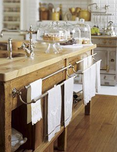 bakers table as island with sink. towel racks. exposed plumbing. Bakers Table, Old Fashioned Kitchen, Kitchen 2020, Vintage Towels, Towel Racks, House Beautiful, Unique Kitchen, White Kitchen Cabinets, Counter Tops