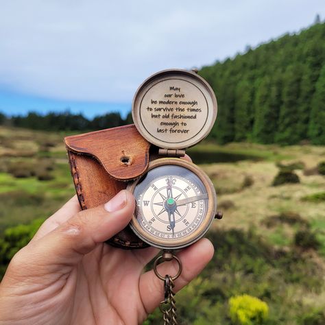 This engraved custom compass is the perfect personalized gift for the adventurous spirit in your life! Made from high-quality brass, this unique keepsake combines vintage nautical charm with functional design. Whether you're shopping for a loved one, friend, or colleague, this custom compass makes an unforgettable Christmas gift that will be treasured for years to come. The compass is fully customizable with up 120 characters per lid, allowing you to add a personal touch, such as initials, a sig Engraved Compass, Engraved Handwriting, Text Symbols, Nautical Gifts, Camping Games, Vintage Nautical, Wooden Case, Anniversary Wedding, Handcrafted Leather