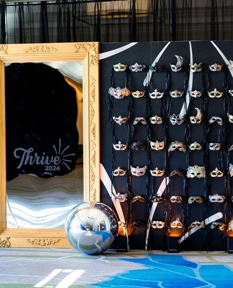 Elegance and mystery in every detail ✨💫 Behold our custom gold and silver mask wall and vintage framed mirror at the Thrive 2024 event.

#maskwall #masquerade #vintagemirror #mirror #framedmirror #goldmirror #blackandgold #silverandgold #elegantdecor #masqueradedecor #masqueradeball #thrive2024 #golddecor #blackdecor #eventdecor #florida #masks #mask #customdecor #customwall Masquerade Charity Ball, New Year’s Eve Masquerade, Masquerade Corporate Event, Masquerade Ball Fundraiser, Masquerade Ball Themed Party, Mirror Themed Party, Masquerade High School Dance, Great Gatsby Activities, Masquerade Event Decor