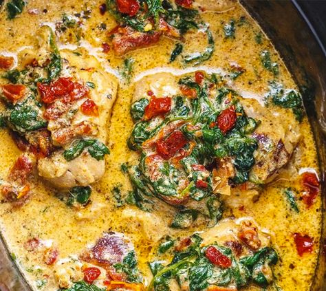 This+is+a+low+sodium+take+on+a+creamy+and+delicious+Italian+Classic+Meal+"Crock-Pot+Tuscan+Garlic+Chicken".+Packed+with+flavors+and+so+easy+to+prep!+This+creamy+Tuscan+Chicken+in+the+Crock+Pot+makes+a+great+low+sodium+dinner+the+family+will+love.+Packed+with+fresh+garlic,+spinach,+and+sun-dried+tomatoes+and+drenched+in+a+creamy+parmesan+sauce,+the+dish+develops a+wonderful+aroma+when+slow+cooking+with+chicken+in+the+crockpot.+If+you’re+looking+for+a+hearty+meal+to+comfort+yourself+by+the+co Crockpot Tuscan Chicken, Cooking With Chicken, Italian Crockpot Recipes, Tuscan Garlic Chicken, Creamy Parmesan Sauce, Tuscan Chicken, Low Sodium Recipes, Sun Dried Tomatoes, Spinach Stuffed Chicken