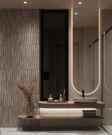 Discover a beautiful bathroom with stylish LED lighting, rounded shapes, textured walls, and chic black accents on beige interiors. Every detail radiates pure luxury 👌🏼 Follow @lyxvillan for more inspiration Credit: @tawazon_architects #luxuryliving #luxurybathroom #luxurybathrooms #modernbathroom #lightingdesign #lightingideas #lightinginspiration #bathroomlighting Luxurious bathroom, LED lighting, rounded shapes, textured walls, black accents, beige interiors, stylish design, elegant b... Bathroom Black And Beige, Bathroom Modern Lighting, Contemporary Washroom Design, Door Design Interior Unique, Wc Modern Design, Powder Room Design Modern, Tawazon Architects, Luxury Bathroom Black, Dark Moody Bathroom Ideas