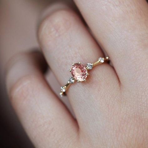 Capucinne 💎 on Instagram: “Our Ophelia ring this time with peach sapphire 🧚🏻‍♀️ A beautiful ring, captivating yet delicate enough for everyday wear. On a scale from…” Peach Sapphire Rings, Peach Sapphire Engagement Ring, Oval Sapphire Ring, Peach Sapphire, Oval Diamond Engagement, Teal Sapphire, Oval Diamond Engagement Ring, Pink Sapphire Ring, Solid Gold Band