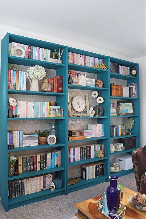 How we completed our ikea billy bookcase hack with before and after pictures. Blue Billy Bookcase With Doors, Navy Billy Bookcase, Ikea Blue Billy Bookcase, Renter Friendly Billy Bookcase, Ikea Billy Bookcase Without Back, Wallpaper Bookcase, Ikea Billy Hack, Billy Hack, Bookcase Hack