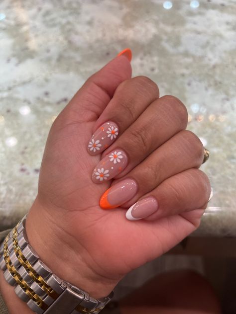 summer nails #flowers #orange #almondnails Summery Flowery Nails, Pastel Orange Nails With Flowers, Orange Nails White Flowers, Orange And Flower Nails, Almond Nails Orange French Tip, Orange And White Short Nails, Orange Nails Acrylic Square, Summer French Tips With Flowers, White And Orange French Tip Nails