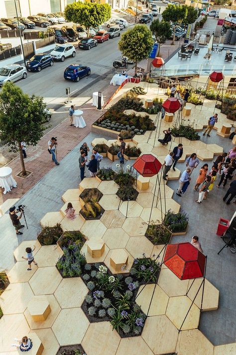 This urban garden, named Zighizaghi, is a multi-sensory garden made of two levels, a horizontal level, the hexagonal floor and seating area, and a vertical level, the lighting and sound systems. There's also numerous plants included in the design, like lemon trees and lavender. Villa Architecture, Pocket Park, Urban Landscape Design, Public Space Design, Sensory Garden, Best Architects, Landscape Architecture Design, Urban Park, Urban Furniture