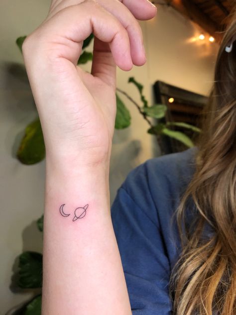 Taylor swift tattoo, moon and saturn tattoo, planets tattoo, tiny tattoo, simple tattoo, wrist tattoo Stars Do You Like Dem Tattoo, Back Of The Wrist Tattoos, Saturn Tiny Tattoo, Simple Moon And Saturn Tattoo, Tattoos For Taylor Swift, Simple Taylor Swift Tattoo Ideas, Taylor Swift Tattoo Delicate, Last Kiss Tattoo Taylor Swift, Small Moon And Saturn Tattoo