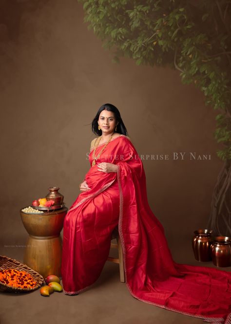 "Embracing motherhood the traditional way – where elegance meets maternity. 🌼🤰 #IndianMaternity #TraditionAndMotherhood #BumpAndBeauty" Maternity Poses At Home, Metarnaty Photoshoot, Maternity Photo Shoot Ideas Indian, Props For Maternity Shoot, Baby Shower Look For Mom, Maternity Photo Shoot Ideas In Saree, Maternity Indoor Photography, Traditional Pregnancy Photoshoot, Saree Maternity Photoshoot