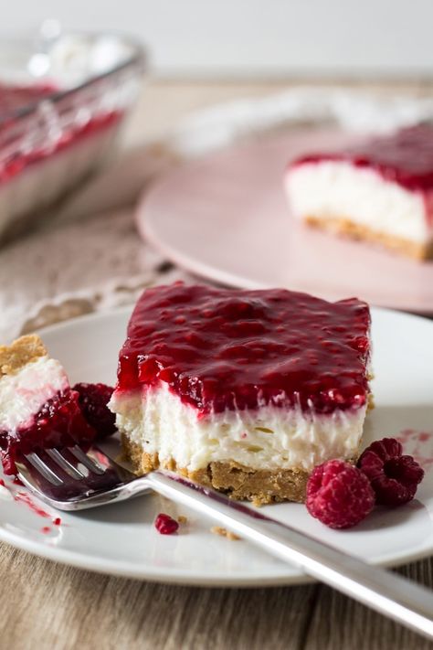 Fruity No Bake Cheesecake, Easy Icebox Pie, Cheesecake With Raspberry Topping, Raspberry Graham Cracker Dessert, Raspberry Lasagna Dessert, Raspberry Delight Dessert, No Bake Raspberry Cheesecake Bars, No Bake Cheesecake Squares, No Bake Raspberry Cheesecake Recipes