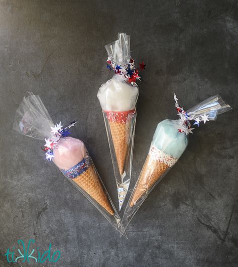 I had fun testing out my patriotic ice cream cones with actual ice cream yesterday, but I actually had a different plan for them: patriotic cotton candy faux ice cream cones!&#13; &#13; Diy Cotton Candy Cones, Ice Cream Cone Cotton Candy, Mini Cotton Candy Sticks, Cotton Candy Ice Cream Float, Cotton Candy In Ice Cream Cone, Cotton Candy Cone, Cone Dessert, Cones Diy, Kids Food Crafts