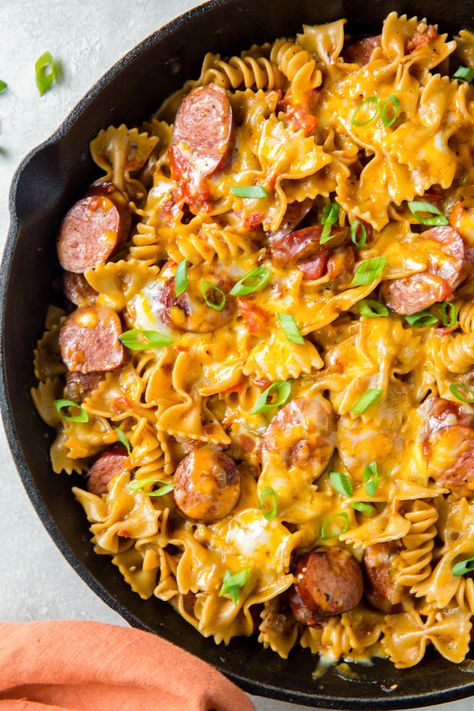 One Pan Cheesy Smoked Sausage Pasta recipe has smoked sausage and pasta in a spicy, creamy sauce that's all cooked in one pan for a quick weeknight meal. Cheesy Sausage Skillet, One Pot Cheesy Smoked Sausage Pasta, Cheesy Smoked Sausage Skillet, Spicy Pasta With Sausage, Cheesy Pasta And Sausage, Smoked Beef Kielbasa Recipes, One Pan Cheesy Smoked Sausage And Pasta, One Pan Sausage Pasta, One Pot Cheesy Sausage Pasta