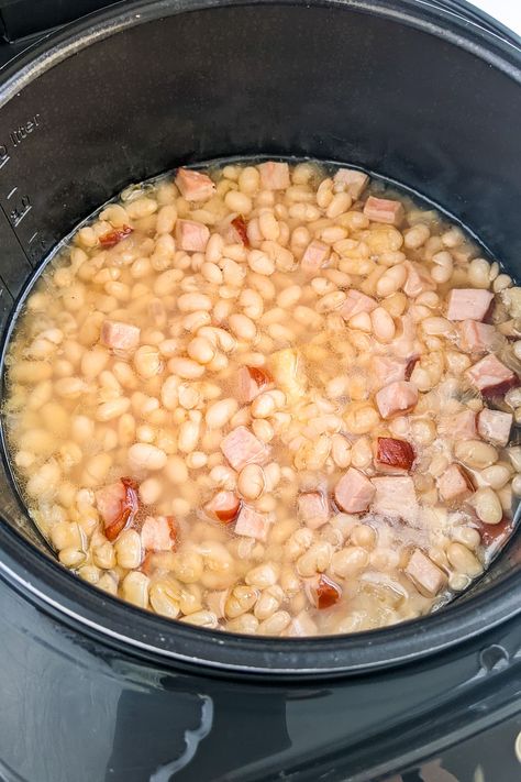 Take a trip down memory lane with this classic Old Fashioned Ham and Beans Stew. Made with slow-cooked ham, tender navy beans and a blend of spices, this stew is the ultimate comfort food. Perfect for a chilly day or a casual family dinner. Serve with crusty bread for a satisfying meal. Ham And String Beans, Ham And Bean Soup Recipes Stovetop, Best Ham And Beans Recipe, Ham And Beans Stovetop, Old Fashioned Ham, Navy Beans And Ham, Country Fried Pork Chops, Crockpot Ham And Beans, Slow Cooked Ham