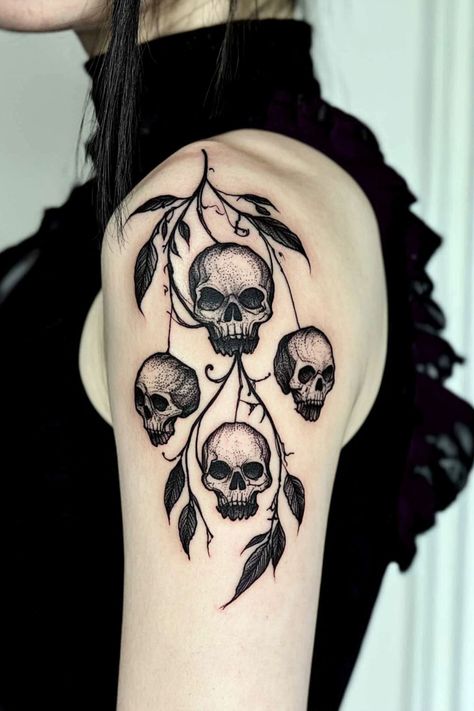 A gothic-themed arm tattoo for women featuring skulls and leaves for a dark, artistic style. Cool Gothic Tattoos, Gothic Shoulder Tattoos For Women, Gothic Vine Tattoos, Gothic Arm Tattoos For Women, Simple Chest Tattoos Female, Goth Shoulder Tattoo, Goth Arm Tattoo, Gothic Forearm Tattoo Women, Edgy Tattoos