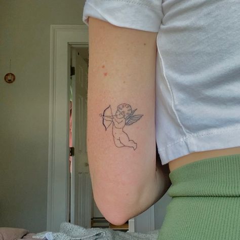 Cherub Tattoo Placement, Cherub Arrow Tattoo, Angel Bow And Arrow Tattoo, Cupid Tattoo Ideas, Fine Line Cherub Tattoo, Cherub Angel Tattoo Simple, Cupid Bow Tattoo, Cupids Bow Tattoo, Cherub Tattoo Designs