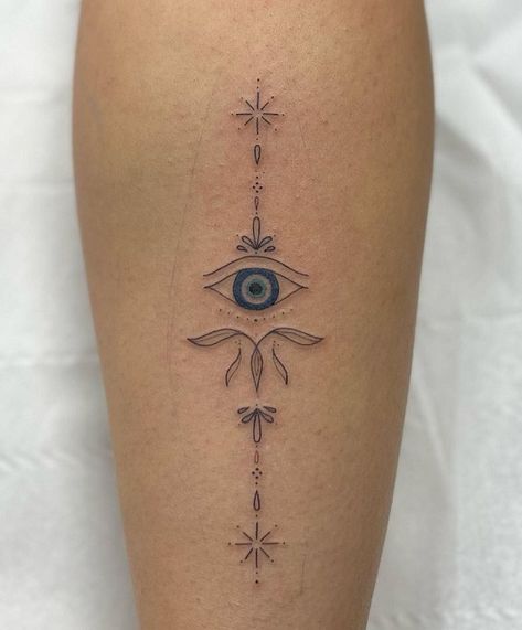 18 Unique Evil Eye Tattoo Designs for Charm and Positivity Protection From Evil Eye Tattoo, Eyes Tattoo Ideas Women, Evil Eye Tattoo Meaning Symbols, Evil Eye Back Tattoo Women, Evil Eye Tattoo Leg, Sun Evil Eye Tattoo, Minimalist Tattoo Evil Eye, Mexican Evil Eye Tattoo, Evil Eye Sleeve Tattoo