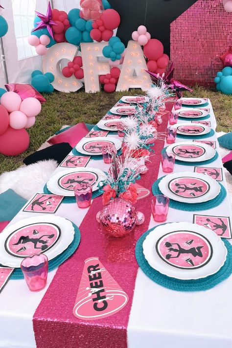 Don't miss this pretty cheerleading birthday party! The table settings are fab! See more party ideas and share yours at CatchMyParty.com Cheerleading Table Centerpieces, Cheerleading Birthday Party Decorations, Cheer Pool Party Ideas, Cheer Birthday Party Decorations, Cheer Theme Birthday Party, Football And Cheer Birthday Party, Cheerleader Themed Birthday Party, Cheerleading Themed Birthday Party, Cheerleader Party Ideas