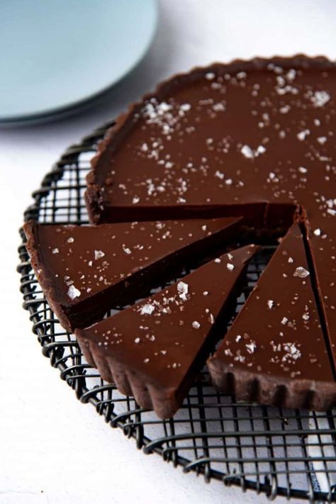 A simple chocolate tart is a fancy, decadent dessert! This creamy chocolate ganache tart is easy to make, and I’ve provided shortcuts to make the recipe even easier! #chocolate #dessert Salted Caramel Tart, Chocolate Tarts Recipe, Chocolate Ganache Tart, Chocolate Ganache Filling, Caramel Tart, Chocolate Torte, Tart Dessert, Salted Chocolate, Fancy Desserts