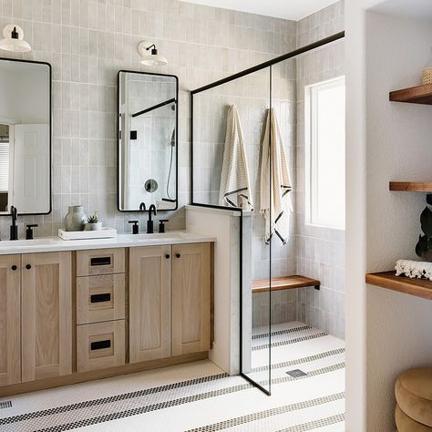 Gray herringbone tile floor bathroom