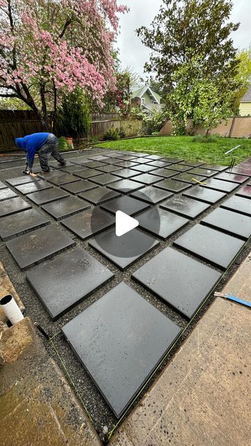 Prestige Landscape & Tree on Instagram: "Pavers going down!⬇️  Who’s ready for the weekend?  #paversdown #paver #largepaver #patio #2x2pavers" Concrete Pavers With Rocks In Between, Pavers And Moss Patio, Rectangular Pavers Walkways, Small Stones Garden Ideas, Paving And Stones Ideas, Back Porch Paver Ideas, Front Yard Paving Ideas, Paved Backyard Ideas Concrete Patios, Outdoor Patio Flooring Ideas Stones