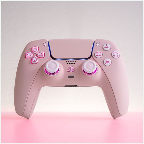 [AffiliateLink] Pink And Stunning, This Ps5 Controller Is Customized To Perfection. Fitted With A Light Sakura Pink Shell, It Boasts An Led Mod That Illuminates Its White Buttons And Analogue Sticks, Making It A Showstopper In Your Hands And A Stunning Piece Of Gaming Hardware As It Rests Next To Your Ps5. Your Gaming Setup Will Never Be The Same.When A Gaming Controller Is Engineered Pretty Much To Perfection Like The Ps5, You Really Wonder What Is Left For Us #pinkgamingsetup Pink Ps5, Pink Games, Gamer Setup, Ps5 Controller, Gaming Controller, Gaming Room Setup, Gamer Room, Pc Setup, Pink Girly Things