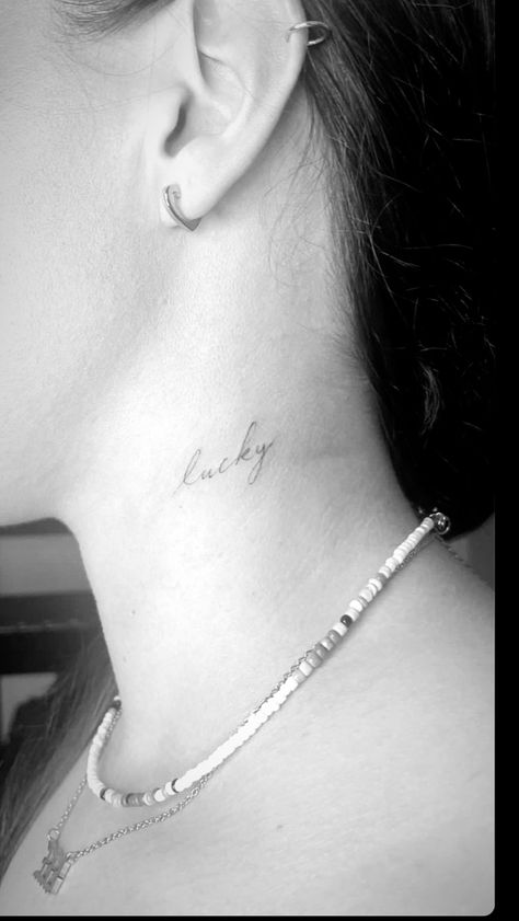 Lucky tattoo, fine line Lucky In Cursive Tattoo, Lucky Small Tattoo, Lover Fine Line Tattoo, Lucky Font Tattoo, One Word Fine Line Tattoo, Lucky Neck Tattoo, Lucky Cursive Tattoo, Lucky Name Tattoo, Fine Line Back Of Neck Tattoo