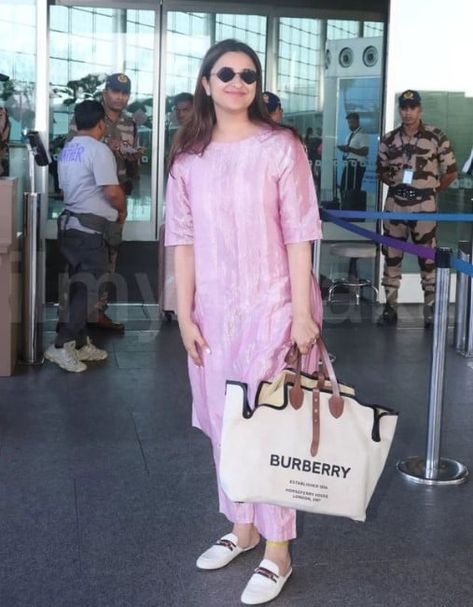 Parineeti Chopra is riding high in her personal life as she recently got engaged to AAP MP, Raghav Chadha. Ever since her engagement, Parineeti has been dropping adorable glimpses with her soulmate, Raghav. The actress was recently papped at the airport, and she looked stunning as she donned a breezy outfit.
 
 Parineeti Chopra donned a metallic 'kurta' worth Rs. 28K
 
 For her airport look, Parineeti opted for a metallic nova kurta set from the brand Anavila worth Rs. 28,000.... Parineeti Chopra Outfits, Pareeniti Chopra, Kurtis Style, Raghav Chadha, Gucci Princetown Slipper, Parneeti Chopra, Kurtis Design, Engagement Look, Stylish Kurtis