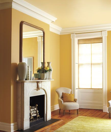 Have a sunny disposition? Make sure your home reflects it with a tone-on-tone yellow and white paint job. Gold Paint Colors, Rugs Colorful, Decor Eclectic, Room Painting, Yellow Room, Yellow Living Room, Room Color, Yellow Walls, The Fireplace