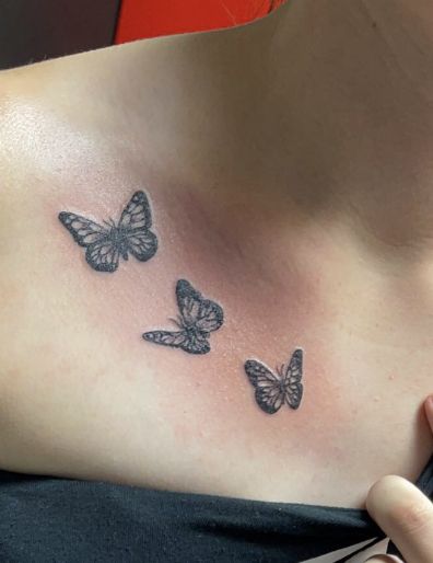 Three butterflies across the collarbone 3 Butterfly Tattoo Small Collarbone, Colar Bone Butterfly Tattoo For Women, Colar Bone Tattoo Butterflies, Butterfly Tattoo On Collar Bone For Women, Butterfly Tattoos On Collar Bone, Butterflies On Collarbone Tattoo, Butterfly Tattoo On Front Shoulder, 3 Butterfly Tattoo Collar Bone, Butterfly Tattoo Under Collar Bone