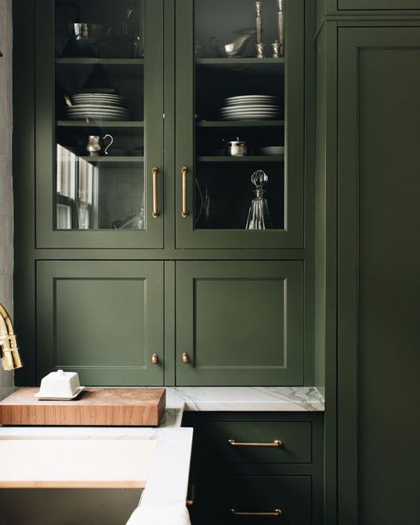 Jean Stoffer on Instagram: “I am so in love with this color “Eden Green” as seen here in our Fair Oaks kitchen. I’ll be using it in a space at #TheMadisonGR  Do you…” Appliance Garage Glass Doors, European Overlay Cabinets, Olive Green Cupboards, Olive Mudroom, Green Butlers Pantry, Olive Cabinets, Green Cupboards, Mudroom Cabinet, Rich Kitchen