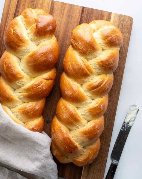 Easy Challah Bread is a delicious and slightly sweet braided yeast bread with a golden crust and a soft, tender interior. Serve challah bread sliced with butter, for French toast, in sandwiches, as toast with various toppings, or as a snack! Easy Challah, Bread Braid, Challah Bread Recipes, Gourmet Breakfast, Braided Bread, Challah Bread, Bread Serving, Yeast Bread, Challah