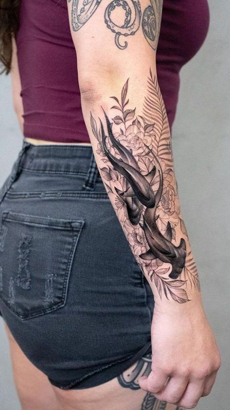 Dive into the deep with shark tattoo ideas. Explore designs that capture the strength and majesty of these fascinating ocean predators. Feminine Shark Tattoo For Women, Ocean Theme Tattoos, Shark Tattoo Ideas, Ocean Sleeve Tattoos, Flower Spine Tattoos, Whale Tattoos, Shark Tattoo, Bear Tattoos, Ocean Tattoos