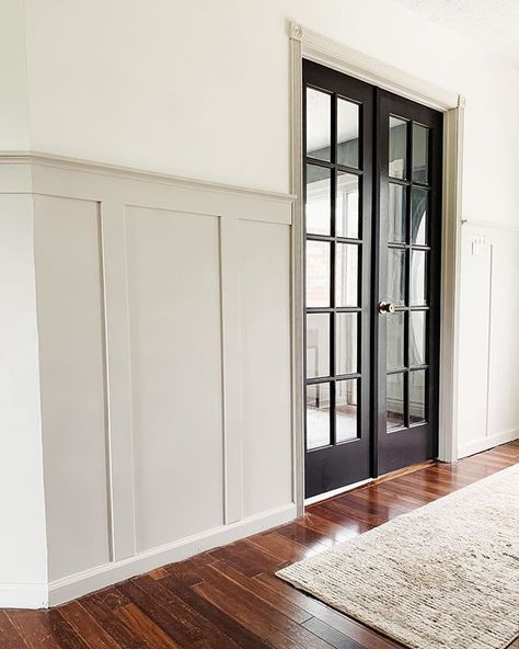 DIY Board and Batten Hallway Update Phase One Greige Molding White Walls, Beige Trim Black Door, Stained Hollow Core Door, Entranceway Paint Colors, Beachy Neutral Aesthetic, Beige Trim And Doors Interior, Neutral Paint Ideas For Living Room, Wall Petition Ideas, Neutral Wall Paint Living Room