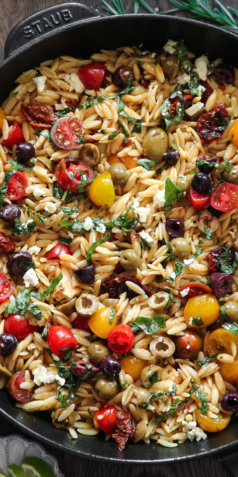 Greek Orzo with Tomatoes, Olives, Basil, and Feta - in a cast iron skillet. Pasta Salad With Tomatoes, Greek Orzo, Mediterranean Recipe, Mediterranean Recipes Healthy, Salad With Tomatoes, Mediterranean Diet Recipes Dinners, Mediterranean Diet Meal Plan, Orzo Recipes, Easy Mediterranean Diet Recipes