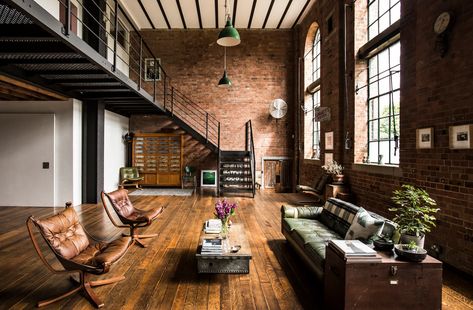 This London location apartment has a large open plan living with exposed brick walls. Double height ceiling and great daylight. Beautiful reclaimed wooden flooring. Exposed Brick Apartment, Loft Apartment Industrial, Brick Apartment, Brick Living Room, Warehouse Apartment, Industrial Loft Design, Open Plan Apartment, Warehouse Living, Warehouse Loft