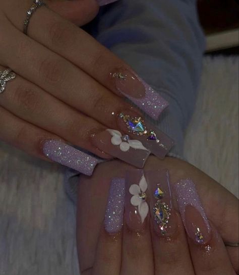 Lilac Baddie Nails, Latina Nail Designs Purple, Lavender Baddie Nails, Silver And Purple Acrylic Nails, Soft Makeup Look With Rhinestones, Purple Prom Nails Coffin, Short Acrylics With Rhinestones, Medium Length Nails With Gems, Purple Xv Nails