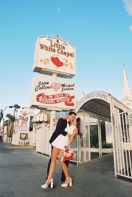 Kitschy Kodak Moments in the Heart of Las Vegas Imagine eloping in the iconic Little White Wedding Chapel, the heart of Las Vegas. Your love story is captured in the romantic hues of 35mm film by an ace film photographer. With a nod to vintage charm, you wear a short, dazzling wedding dress amid neon lights. The downtown landscape is the perfect setting for this kitschy elopement. Let your love story be as unique as you are! Little White Chapel Wedding, White Chapel Wedding, Chapel Elopement, White Wedding Chapel, Las Vegas Wedding Photos, Vegas Bride, Vegas Wedding Photos, Vegas Wedding Chapel, Married In Vegas